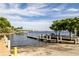 Picturesque dock view with boat lift, scenic waterfront, and serene water, ideal for boating enthusiasts at 1211 64Th Nw St, Bradenton, FL 34209