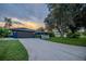 A nicely landscape property featuring an inviting driveway leading to a well-maintained home at 1211 64Th Nw St, Bradenton, FL 34209