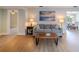 A stylish living room featuring wood-look flooring, a comfortable gray couch, and natural light at 1211 64Th Nw St, Bradenton, FL 34209