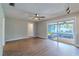 Spacious living room featuring wood flooring and sliding glass doors to the patio at 1211 64Th Nw St, Bradenton, FL 34209