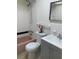Bathroom with pink bathtub, tile walls and a vanity with white countertop at 1257 Drew St # 15, Clearwater, FL 33755
