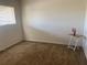 Bedroom with neutral carpet and a table with a flamingo ornament at 1257 Drew St # 15, Clearwater, FL 33755