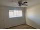 Bedroom with white walls, carpeted floor and a window with blinds at 1257 Drew St # 15, Clearwater, FL 33755