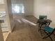 Open floor plan with table and chairs leading to the kitchen with a white stove at 1257 Drew St # 15, Clearwater, FL 33755