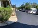 Exterior of parking lot area with cars parked, stairs, and landscaping at 1257 Drew St # 15, Clearwater, FL 33755
