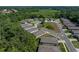Aerial view highlighting the home's position on a quite circle, with nearby homes and lush natural surroundings at 12669 Eastpointe Dr, Dade City, FL 33525