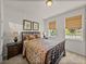 Cozy bedroom with natural light, warm tones, and classic decor creates a relaxing ambiance at 12669 Eastpointe Dr, Dade City, FL 33525