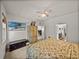 Comfortable bedroom showing furniture and a TV, with natural light streaming through the windows at 12669 Eastpointe Dr, Dade City, FL 33525