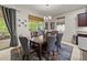 Bright dining area featuring a stylish chandelier and a colorful accent rug at 12669 Eastpointe Dr, Dade City, FL 33525