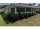 The house features a screened patio with manicured landscaping, offering privacy and outdoor enjoyment at 12669 Eastpointe Dr, Dade City, FL 33525