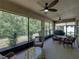 Enclosed lanai with wicker furniture, ideal for enjoying the outdoors in comfort and style at 12669 Eastpointe Dr, Dade City, FL 33525