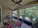 Enjoy the tranquil view on this screened-in patio with outdoor furniture, perfect for leisure and relaxation at 12669 Eastpointe Dr, Dade City, FL 33525