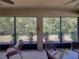A screened-in patio showcases views of the outdoors, offering a serene and private retreat at 12669 Eastpointe Dr, Dade City, FL 33525