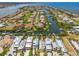An aerial view showing a waterfront community with canal access, private docks, and luxurious homes at 1326 Apollo Beach S Blvd, Apollo Beach, FL 33572