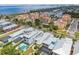 Stunning aerial view of the community with colorful homes, a pond, and a marina in the background at 1326 Apollo Beach S Blvd, Apollo Beach, FL 33572