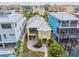 Lovely yellow home with a screened porch, landscaped yard, and neighborhood pool at 1326 Apollo Beach S Blvd, Apollo Beach, FL 33572