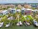 Beautiful community with colorful homes along the waterfront, featuring docks and lush greenery at 1326 Apollo Beach S Blvd, Apollo Beach, FL 33572
