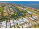Aerial showcasing canal-front homes with boat docks and convenient water access in a coastal community at 1326 Apollo Beach S Blvd, Apollo Beach, FL 33572