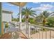 Balcony overlooking tropical palms and nearby buildings and lovely blue skies at 1326 Apollo Beach S Blvd, Apollo Beach, FL 33572