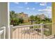Balcony view of lush landscaping and colorful buildings on a sunny day at 1326 Apollo Beach S Blvd, Apollo Beach, FL 33572