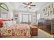 Tranquil bedroom features tray ceiling, bay windows, and closet at 1326 Apollo Beach S Blvd, Apollo Beach, FL 33572