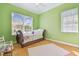 Bright bedroom featuring hardwood floors, a sleigh bed, and plenty of natural light at 1326 Apollo Beach S Blvd, Apollo Beach, FL 33572