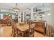 Open concept dining room flows into kitchen, with hardwood floors and abundant natural light at 1326 Apollo Beach S Blvd, Apollo Beach, FL 33572