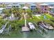 A private dock and boat lift provide convenient water access for this waterfront home at 1326 Apollo Beach S Blvd, Apollo Beach, FL 33572