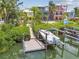 This boat on a lift offers waterfront living and direct access to the water at 1326 Apollo Beach S Blvd, Apollo Beach, FL 33572