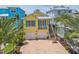 Beautiful two-story yellow home with a spacious two-car garage and well-manicured landscaping at 1326 Apollo Beach S Blvd, Apollo Beach, FL 33572