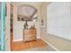 Inviting foyer with hardwood floors, neutral walls, and decorative details at 1326 Apollo Beach S Blvd, Apollo Beach, FL 33572