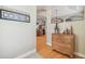 Entryway with hardwood floors, neutral walls, and a glimpse into the kitchen at 1326 Apollo Beach S Blvd, Apollo Beach, FL 33572