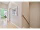 Hallway with wood floors leading to a bedroom with natural light and views at 1326 Apollo Beach S Blvd, Apollo Beach, FL 33572