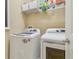 Bright laundry room with modern washer and dryer, and ample storage space at 1326 Apollo Beach S Blvd, Apollo Beach, FL 33572