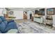 Living room featuring comfortable seating, decorative features, and storage at 1326 Apollo Beach S Blvd, Apollo Beach, FL 33572