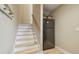 Stairway with access to an upper and lower level with added refrigerator at 1326 Apollo Beach S Blvd, Apollo Beach, FL 33572