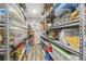 Organized storage room featuring rows of metal shelving filled with clear plastic containers and various household items at 1326 Apollo Beach S Blvd, Apollo Beach, FL 33572