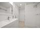 Modern bathroom with sleek vanity, contemporary fixtures, and a glass-enclosed shower for a spa-like experience at 16 Hibiscus Rd, Belleair, FL 33756