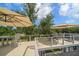 Multi-tiered deck offering ample seating, shade umbrellas, and stunning views of the surrounding landscape at 16 Hibiscus Rd, Belleair, FL 33756