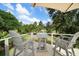 Outdoor deck with seating, perfect for relaxation and enjoying the beautiful golf course views at 16 Hibiscus Rd, Belleair, FL 33756