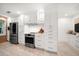 Modern kitchen with white cabinets, stainless steel appliances, and updated countertops at 16 Hibiscus Rd, Belleair, FL 33756