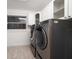 The well-equipped laundry room includes modern washer and dryer units and ample storage space at 16 Hibiscus Rd, Belleair, FL 33756