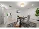 Bright office space with modern decor, natural light, stylish furniture, and a black and white rug at 16 Hibiscus Rd, Belleair, FL 33756