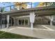 Spacious outdoor patio with stairs and tiered deck featuring backyard views, perfect for outdoor enjoyment at 16 Hibiscus Rd, Belleair, FL 33756