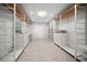 This organized walk-in closet boasts custom shelving and storage, maximizing space and functionality at 16 Hibiscus Rd, Belleair, FL 33756