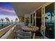 Balcony with table and seating, offering beautiful beach views at 17900 Gulf Blvd # 1B, Redington Shores, FL 33708