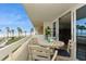 Balcony featuring table and seating, with ocean views at 17900 Gulf Blvd # 1B, Redington Shores, FL 33708