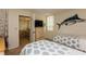 Relaxing bedroom with twin beds, dresser, mounted TV, and marlin wall decor at 17900 Gulf Blvd # 1B, Redington Shores, FL 33708