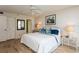 Comfortable bedroom featuring a queen-sized bed with lamps on the side tables at 17900 Gulf Blvd # 1B, Redington Shores, FL 33708
