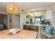 Dining area showcases a light fixture, seating, and connection to kitchen space at 17900 Gulf Blvd # 1B, Redington Shores, FL 33708